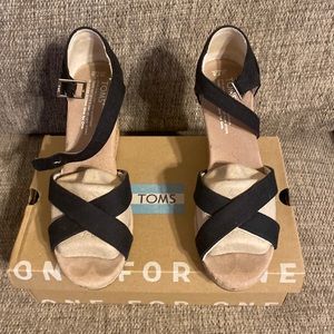 Black canvas strappy cork wedges. Slightly worn. Comfortable.